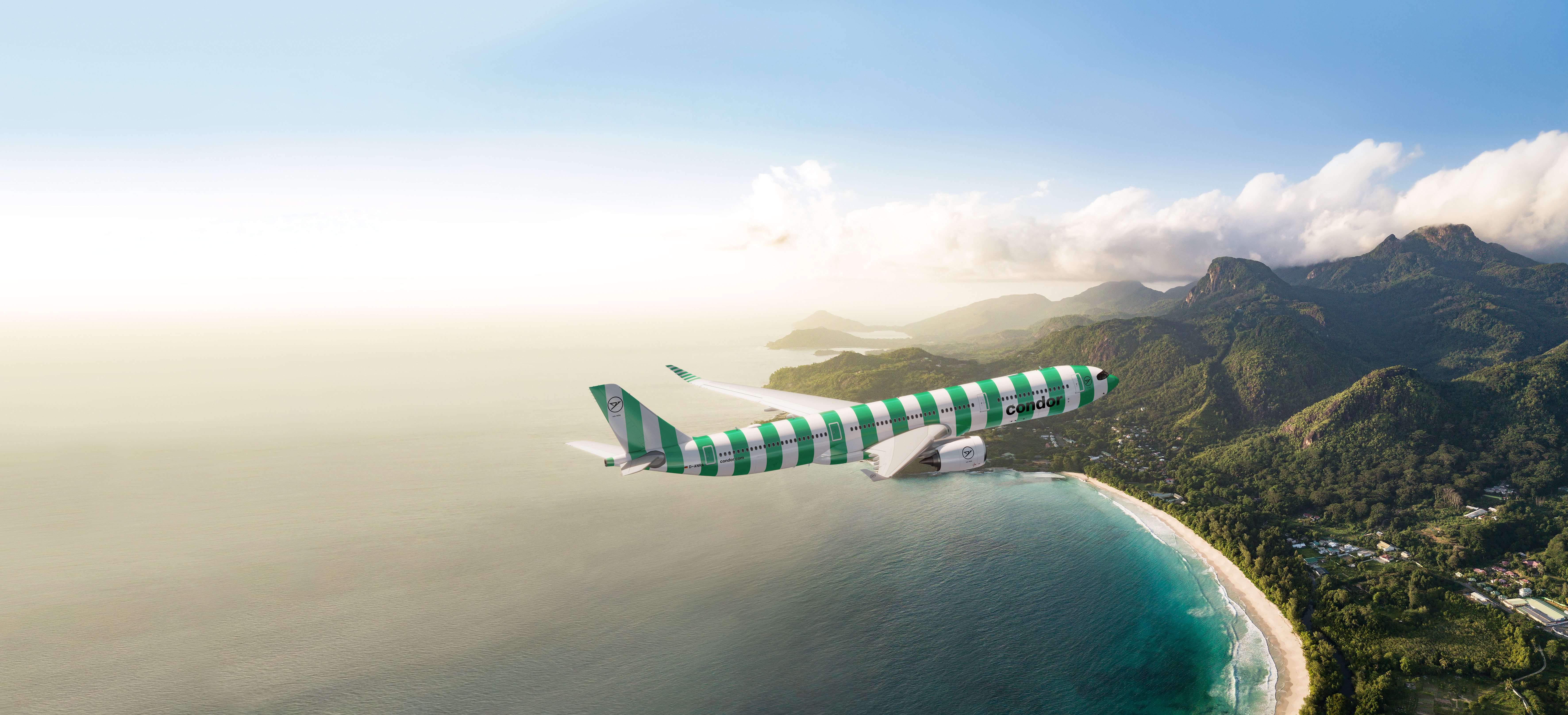 A330neo aircraft with green and white stripes. Aerial view over the Seychelles.