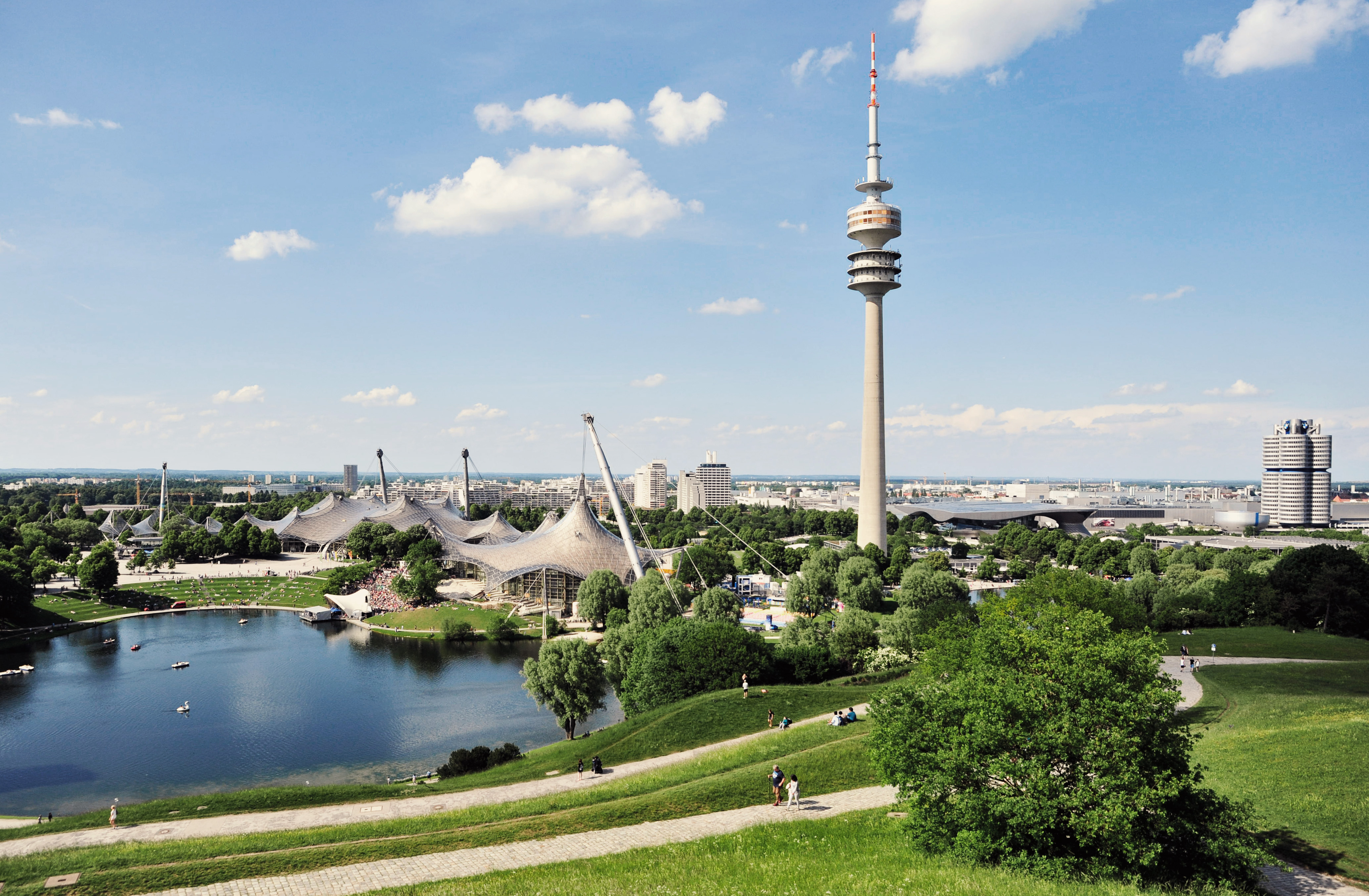 Olympiapark Munich with the Olympic Tower and Olympic Stadium on a sunny day.